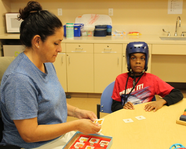 Teacher and student work on sight words