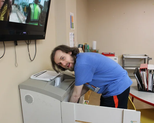 Participant cleaning out copy machine